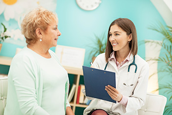 Older female patient consulting with a young diabetic nurse educator
